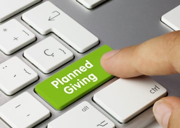 computer keyboard and one of the keys says planned giving signifying estate planning in Texas