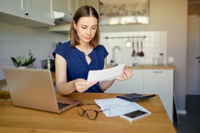 texas investor reviewing her financial plan at her kitchen table